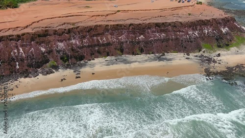 Praia da Pipa (Pipa Beach, Praia de Pipa), Brazil. Coconut palm plantations, sand dunes, and cliffs surround the warm waters that are home to dolphins and sea turtles. photo