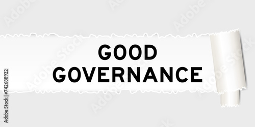 Ripped gray paper background that have word good governance under torn part