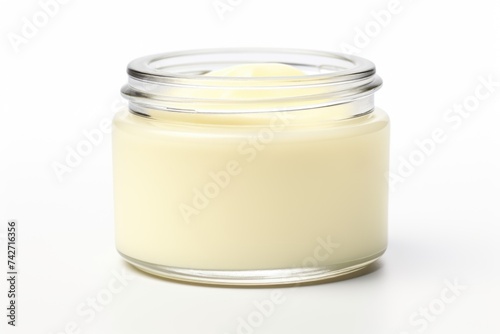 A jar of cream sitting on a table. Suitable for beauty and skincare concepts