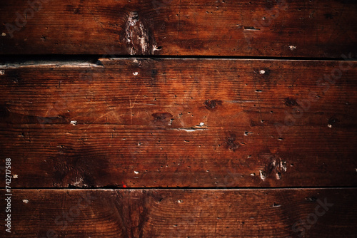 texture of old wood on the facade of a building