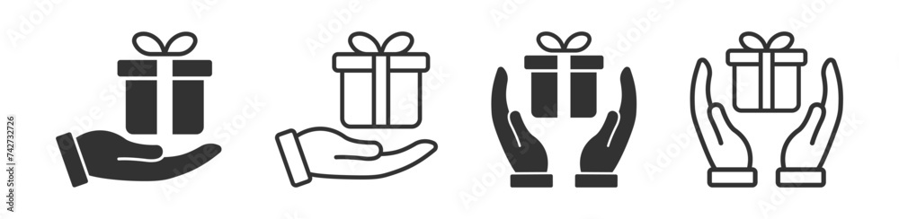 Fototapeta premium Hand holding surprise icon. Christmas, birthday present. Box with ribbon. Celebration sign.