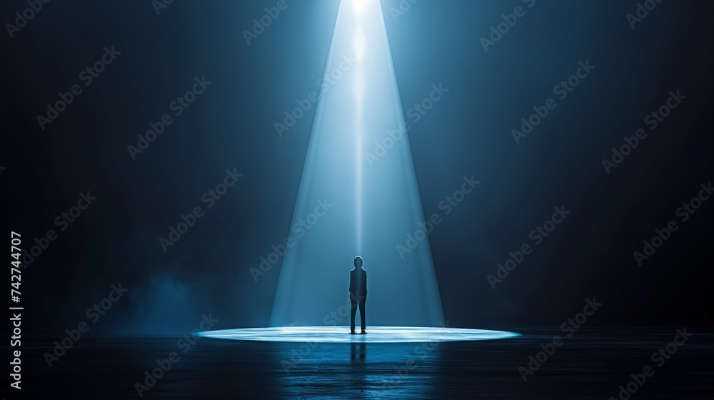A person standing alone on a stage, spotlighted by a single beam of light, surrounded by darkness, reflecting the vulnerability of facing one's fears. 8k