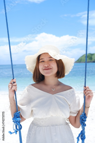 person, sea, happiness, caucasian, female, ocean, sun, tropical, young, beauty, blue, girl, holiday, lifestyle, nature, sky, vacation, water, beach, lombok, summer, travel, back, hat, joy, jump, laugh