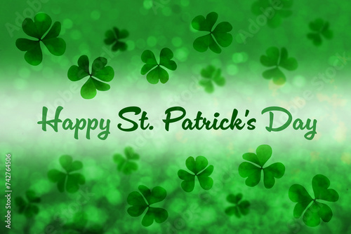 Happy St. Patrick's day card. Text and clover leaf illustrations on green background with bokeh effect