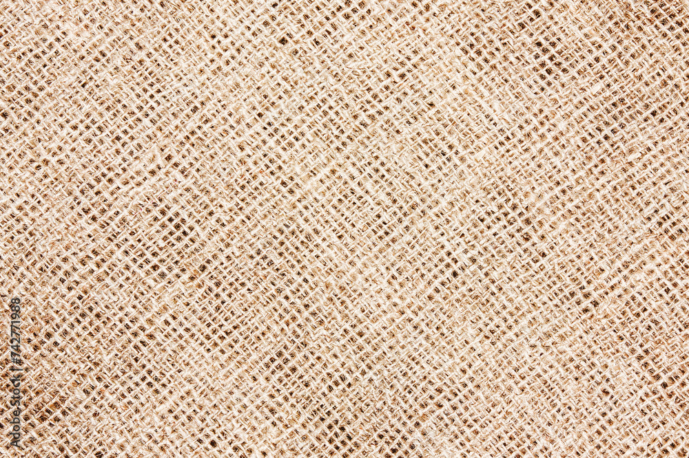 Natural brown linen fabric background. Fiber structure texture. Vintage canvas pattern. Natural brown linen fabric background. Fiber structure texture. Vintage canvas pattern.