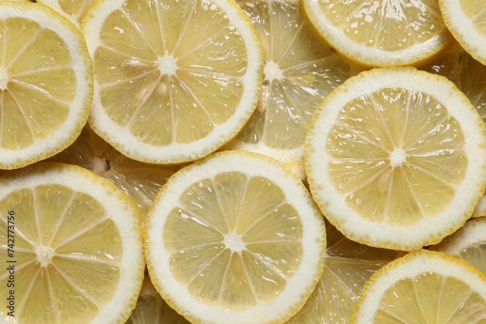 Slices of fresh lemons as background, top view Slices of fresh lemons as background, top view