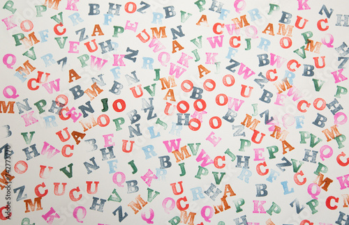 pattern with color letters made with a stamp