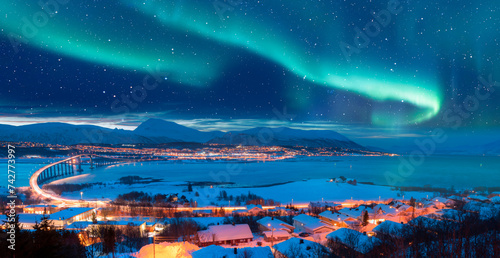 Valokuva Aurora borealis or Northern lights in the sky over Tromso with Sandnessundet Bri