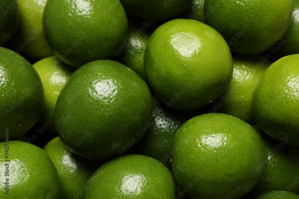 Many fresh ripe limes as background, top view Many fresh ripe limes as background, top view