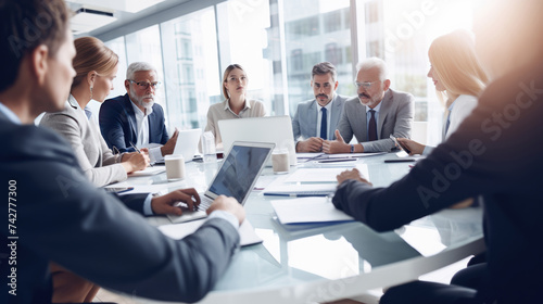 Teamwork, meeting and business people in discussion at the table in modern office for brainstorming and planning. group of corporate employees working on project together in workplace boardroom
