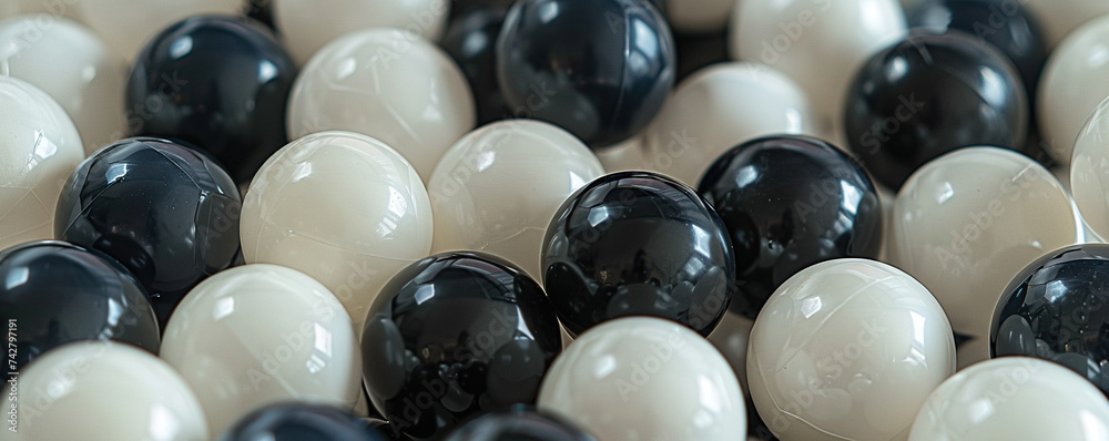 White and black plastic balls selected for a ball pit. White and black plastic balls selected for a ball pit.