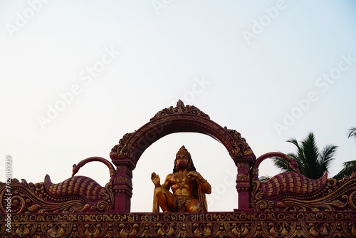 figurine of god hanuman ji on entry gate of temple