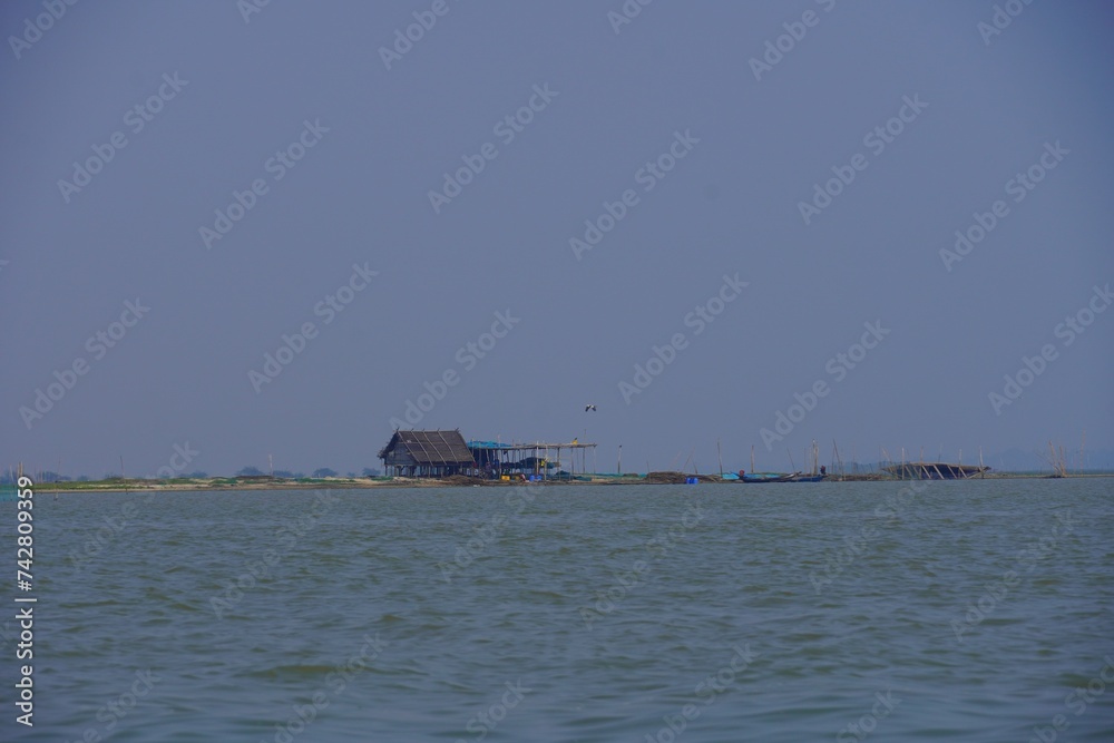 distant view of a hut on beach