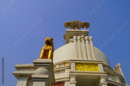 golden lion in dhauli shanti stupa photo