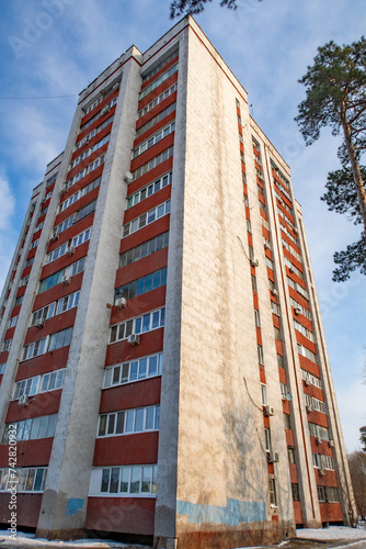 multi-storey residential building against the blue sky in winter