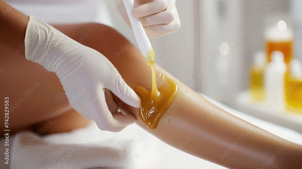 waxing legs, cosmetologist's hands remove hair from girl's skin, beauty salon, sugaring, smooth, self-care, lifestyle, spa salon, shins, knees, woman - obrazy, fototapety, plakaty 