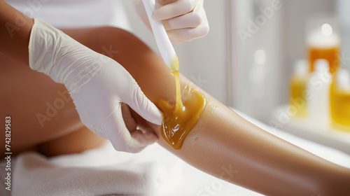 waxing legs, cosmetologist's hands remove hair from girl's skin, beauty salon, sugaring, smooth, self-care, lifestyle, spa salon, shins, knees, woman