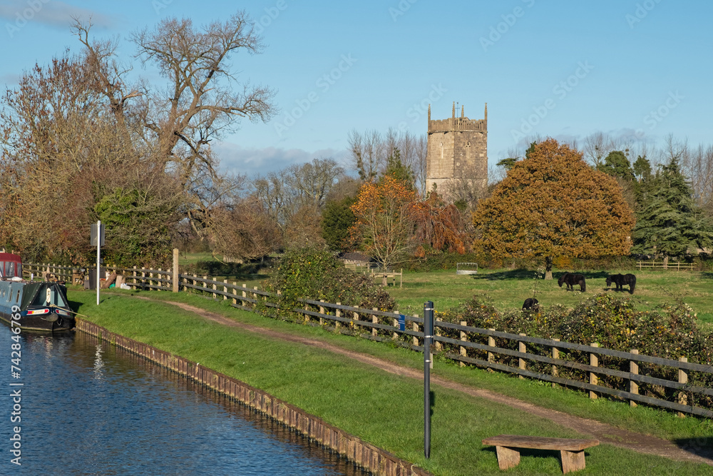 The 14th century parish church of St Mary the Virgin at Frampton on Severn on the east bank of the Gloucester and Sharpness canal in Gloucestershire UK on a sunny  afternoon in autumn