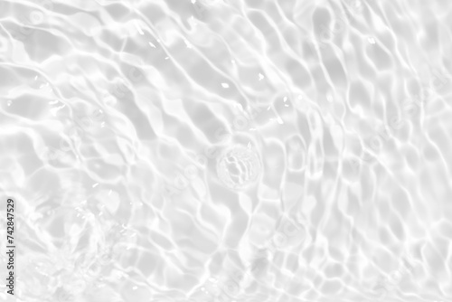 White water surface texture with ripples, splashes, and bubbles. Abstract summer banner background Water waves in sunlight with copy space cosmetic moisturizer micellar toner emulsion. White water.