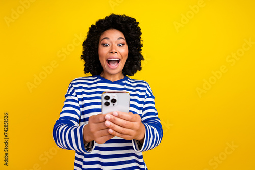Photo of excited glad cheerful girl wear trendy sailor clothes video talk live stream call isolated yellow color background