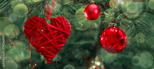 Valentine's Day background with hanging heart shapes on Christmas tree.