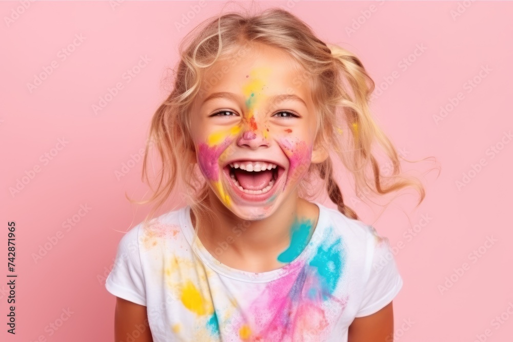 A cheerful young girl shows her hands covered with multicolored paint, her joy unmistakable against a pink background. A cheerful young girl shows her hands covered with multicolored paint, her joy unmistakable against a pink background.