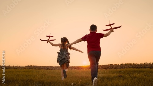 happy boy girl child play airplane pilot sunset, children family dream flying, running playing with my son daughter, young aviators, children enthusiastic energetic friends gather together, experience photo