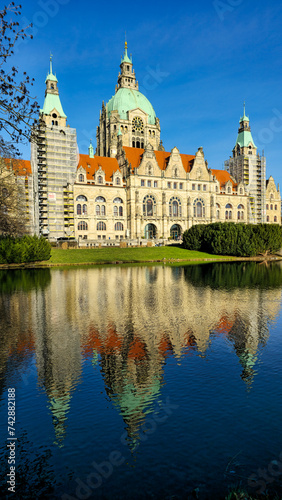 Hanover Maschpark new town hall with beautiful tree reflection in the lake water