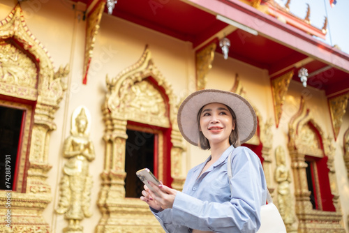 Traveler Asian woman traveling and walking in Bangkok Chiang Mai Temple, Thailand, backpacker female feeling happy spending relax time in holiday trip