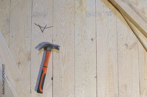 hammer and nails on wood, carpenter's tool