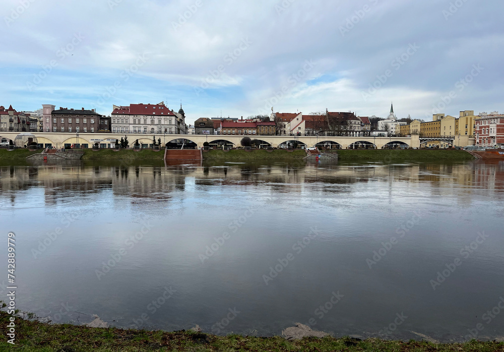 Poland, Gorzow Wielkopolski - 18 February 2024: View of the Warta River. Warta River flood. Flooded banks and embankment. Bildings.
