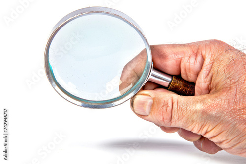 Man's hand, holding classic styled magnifying glass, closeup on white background. Space for text.