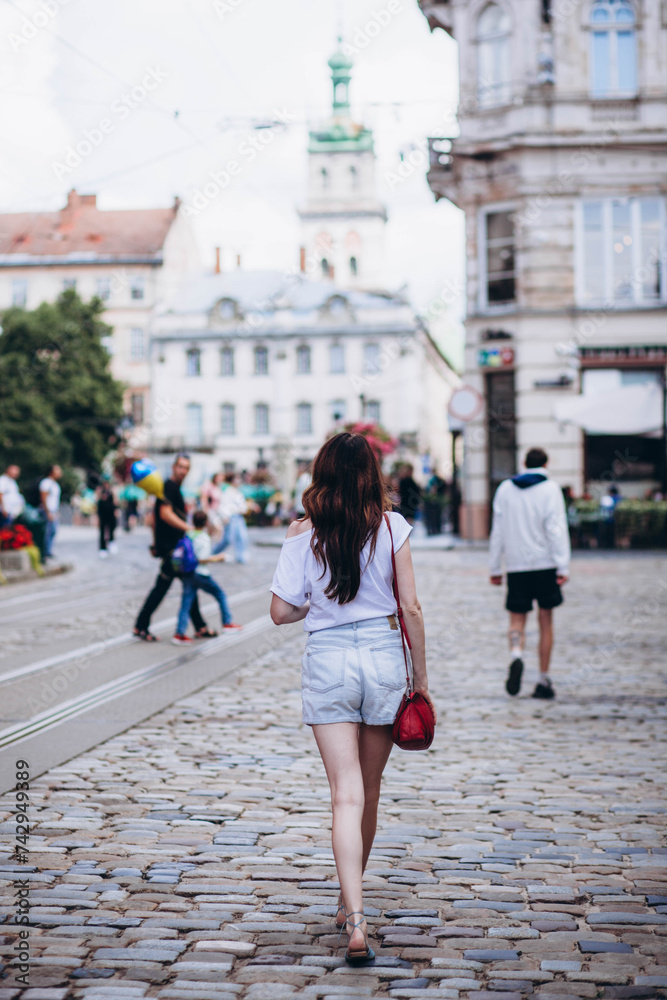 A girl walks along the old streets of Lviv, Ukraine.
