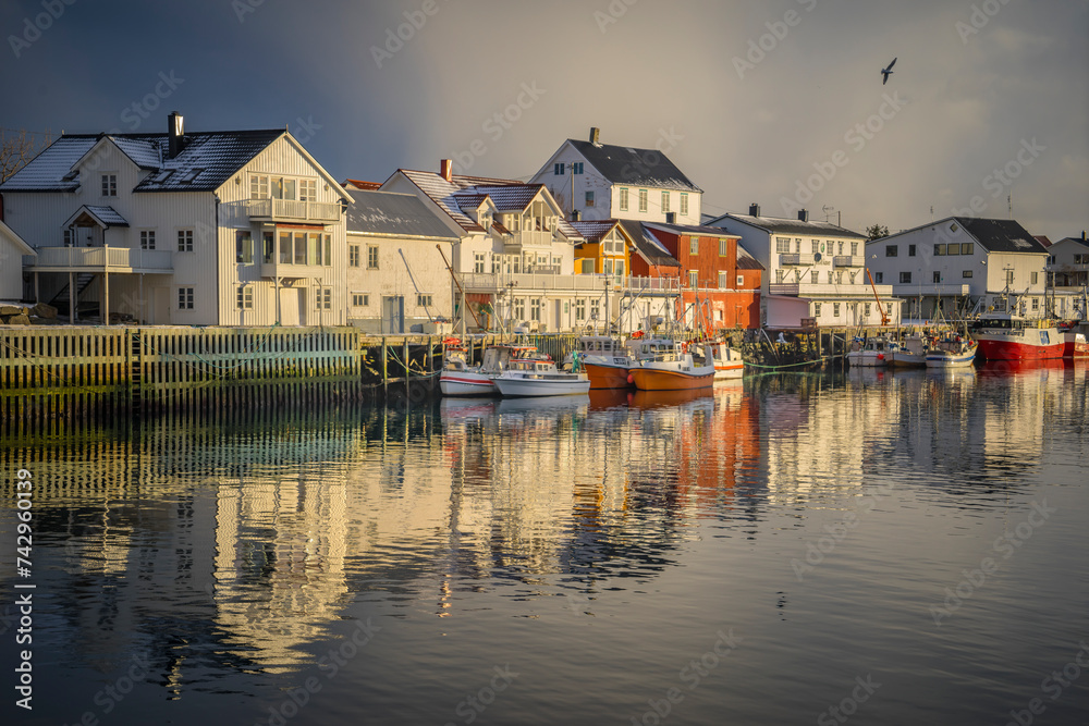 © Travel 'n' Lifestyle - View of a small town along the fjord coastline on Lofoten islands, Scandinavia, Norway.