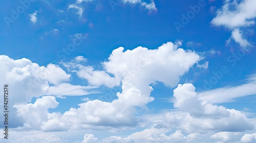 Blue Cloudy Sky Over a Picturesque Landscape: A Serene View of the Majestic White Clouds and Clear