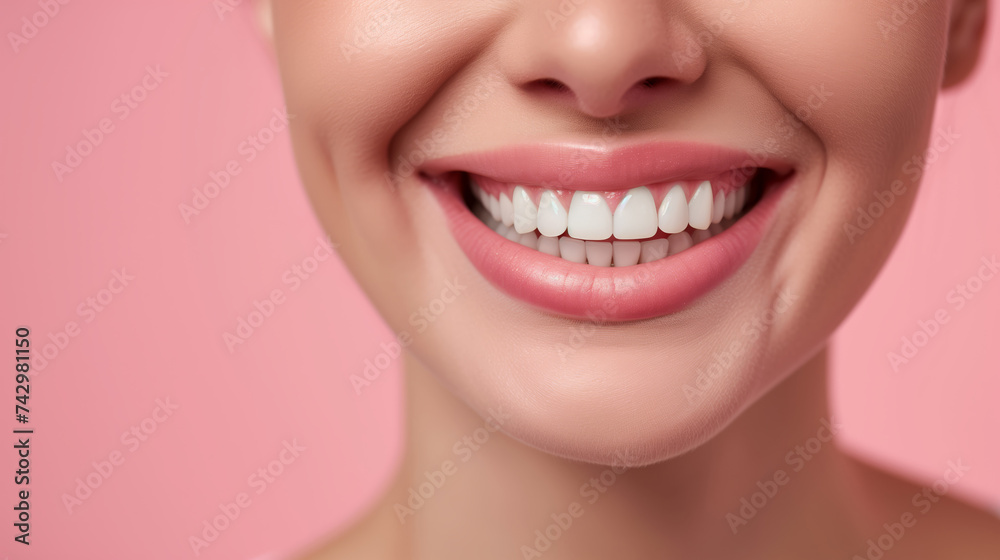 Obraz premium Perfect white teeth, Hollywood smile on a beautiful girl on a pink background