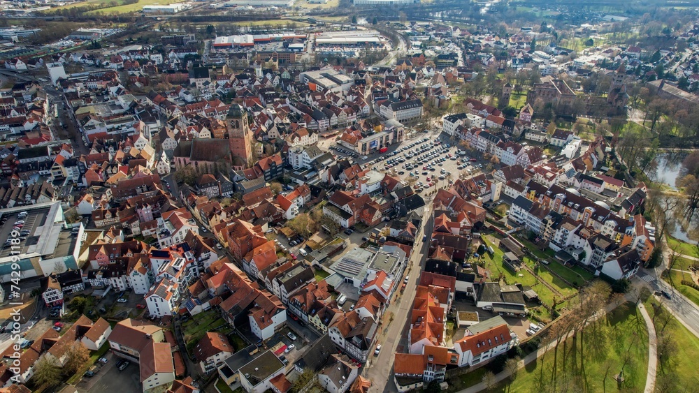 Aerial around the old town of Bad Hersfeld in Germany on a sunny morning in autumn