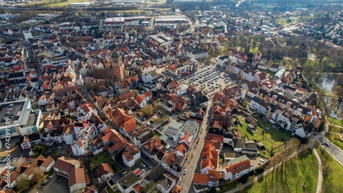 Aerial around the old town of Bad Hersfeld in Germany on a sunny morning in autumn