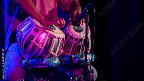 Close up shot of person seen playing the tabla