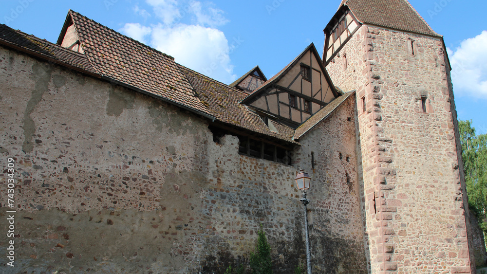 medieval ramparts and house in a village (riquewihr) in alsace in france 