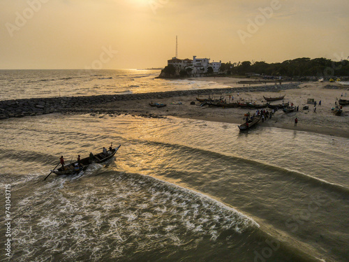 Aerial view of sunset over the serene coastline of Accra, Ghana. photo