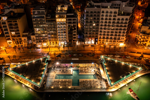 Aerial view of lit Aquapark in Sliema, Central Region, Malta. photo