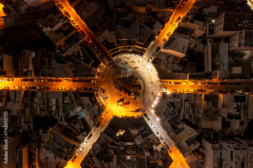 Aerial view of Gzira at night with illuminated roads and modern buildings, Central Region, Malta. photo