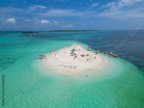 Aerial view of people on a tropical desert island, Zanziba, Tanzania. photo