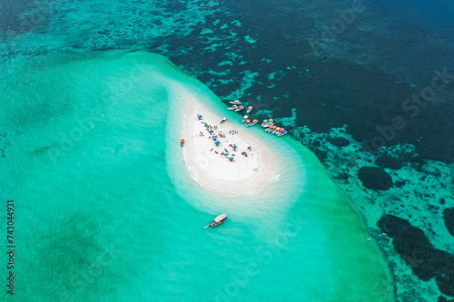 Aerial view of people on a tropical desert island, Zanziba, Tanzania.