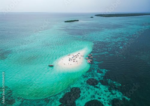 Aerial view of people on a tropical desert island, Zanziba, Tanzania. photo