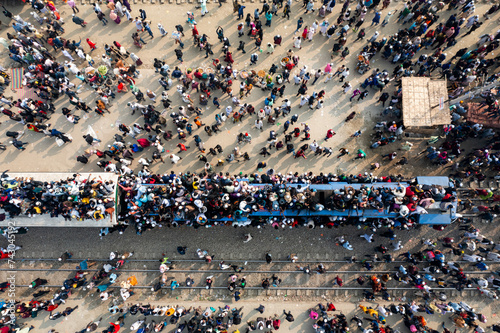 Aerial view of crowded train station with people celebrating festival, Dhaka Division, Bangladesh. photo