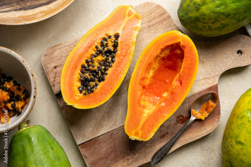 Papaya fruit closeup, sliced fresh papaya fruit with seeds photo