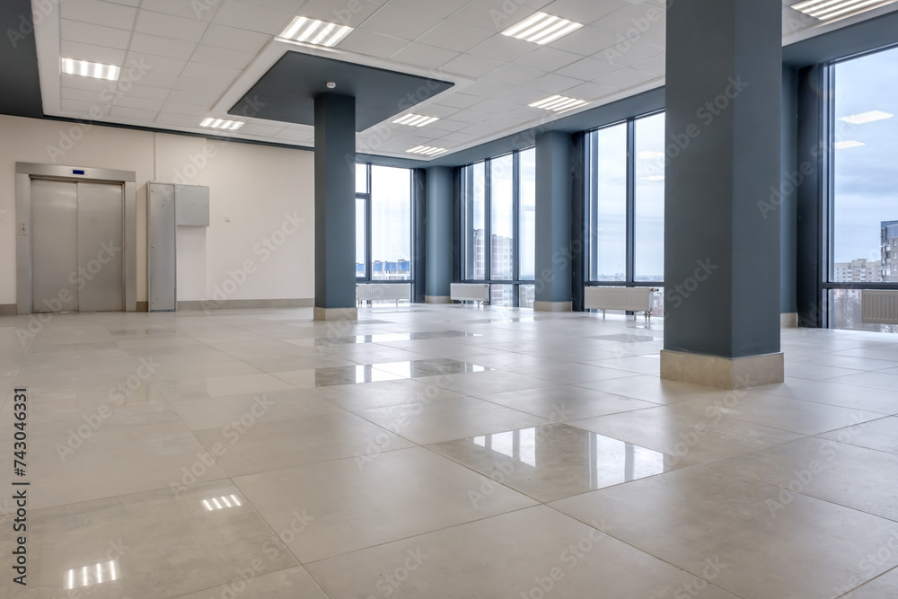panorama view in empty modern hall with columns, doors , stairs and panoramic windows. panorama view in empty modern hall with columns, doors , stairs and panoramic windows.