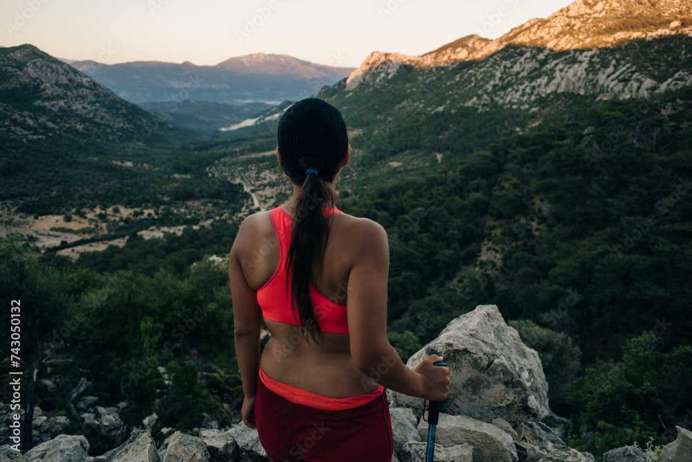 Naklejka premium Hiking on Lycian way. Woman with backpack is trekking in beautiful nature